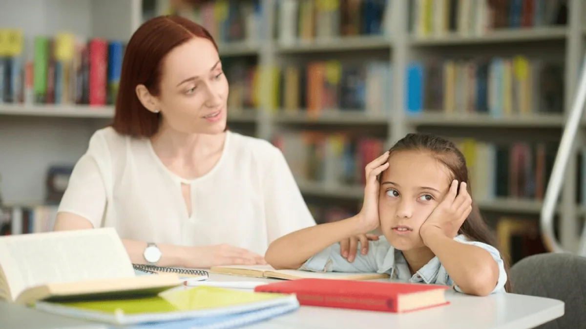 Adverse childhood experiences course learner reading with a young child