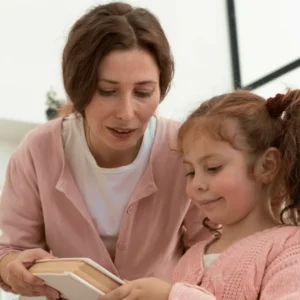 Level 1 Diploma in Caring for Children learner doing a craft activity with a young child