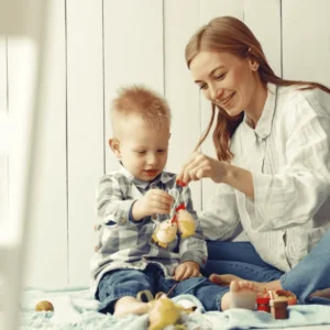 Level 2 Award in Babysitting learner playing with a young child at home