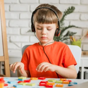 Level 2 Certificate in Understanding Autism learner using a visual timetable with a child