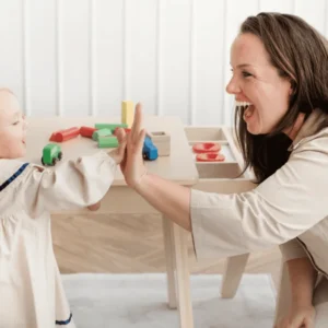 Preparation for the Responsibilities of Parenting course – parent holding a young baby